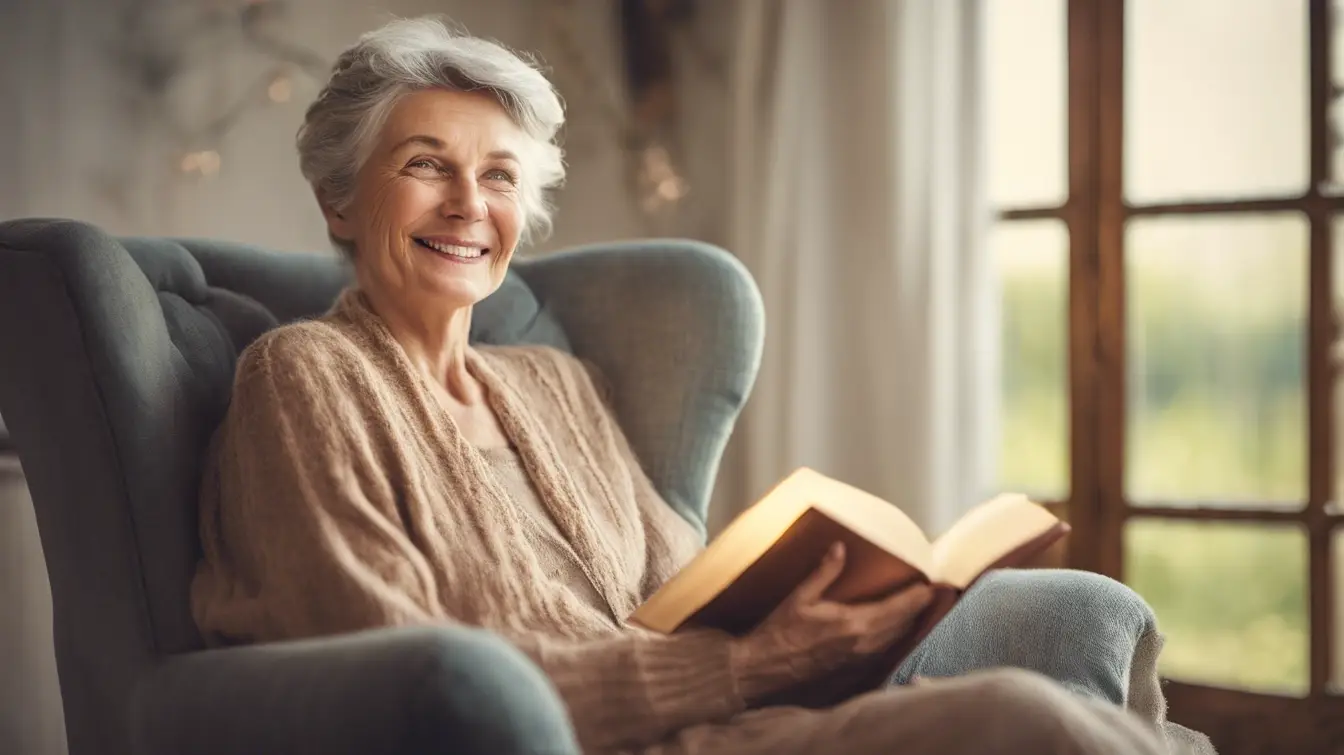 Woman smiling in chair sitting down reading a book.