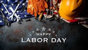 Labor Day tools, hard hat, gloves, and American flag honoring workers – Happy Labor Day celebration